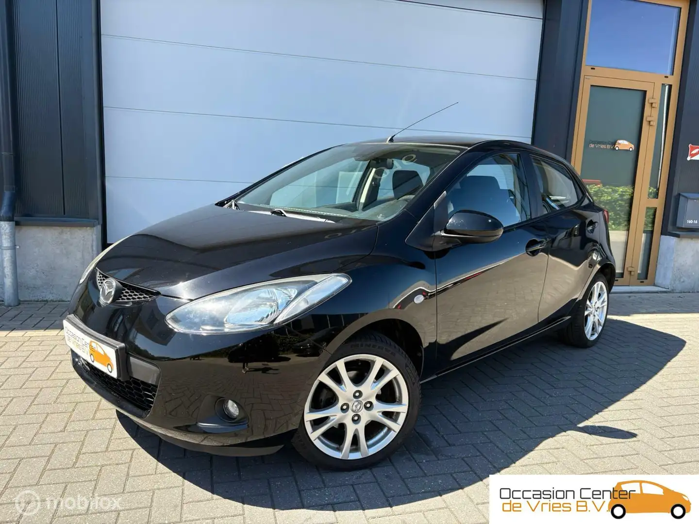 Mazda 2 1.3 Airco Velgen ElektrPakket Stoelverwarm Bluetoo Zwart - 1